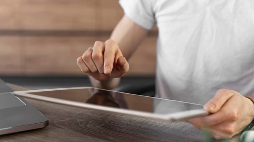 Man using tablet device