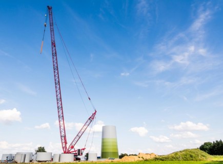 Huge crane for building a windmill at a construction site