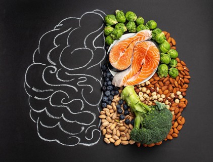 Chalk hand drawn brain with assorted food, food for brain health and good memory: fresh salmon
