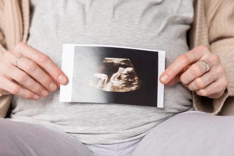 Close up pregnant woman with ultrasound image