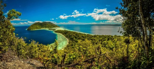 Clear blue sea with wilderness and greenery of Kri island in Raja Ampat in West Papua, Indonesia.