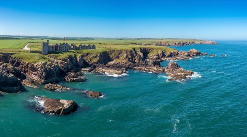 Cruden Bay, United Kingdom - 23 June, 2022: panorama drone view of Slains Castle and the wild coast