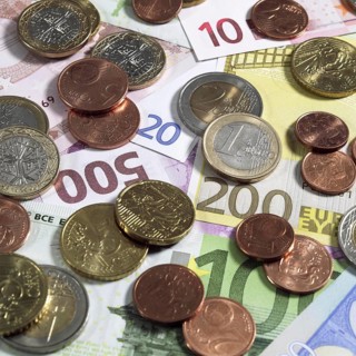 Euro Coins on 10, 20, 100, 200, and 500 Euro Bank Notes