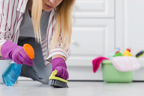 Close up woman spray cleaning floor. Resolution and high quality beautiful photo