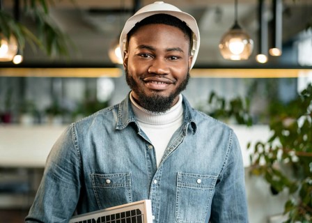 Man posing with helmet medium shot