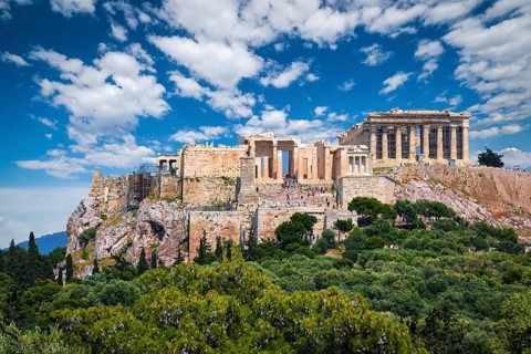 View of Acropolis hill with Propylaea and Parthenon in Athens, Greece from Pnyx hill in summer