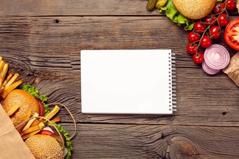 Flat lay burgers with mock up notepad