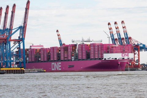Pink container freighter One Innovation of the shipping company Ocean Network Express (Europe) Ltd.