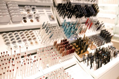 Shelves with makeup products in a cosmetics store indoor with make up products