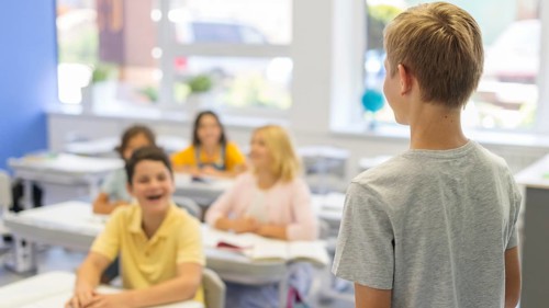 High angle boy presenting class