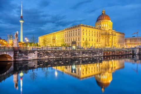 The rebuilt Berlin City Palace and the famous TV Tower by night