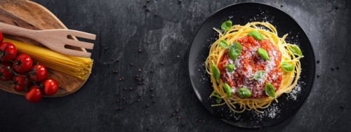 Composition with a plate of spaghetti bolognese
