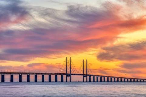 The Øresund Bridge between Denmark and Sweden at a spectacular sunset