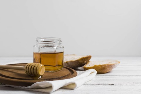 Bread with honey wooden board