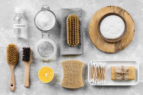 Flat lay eco friendly cleaning products with lemon baking soda