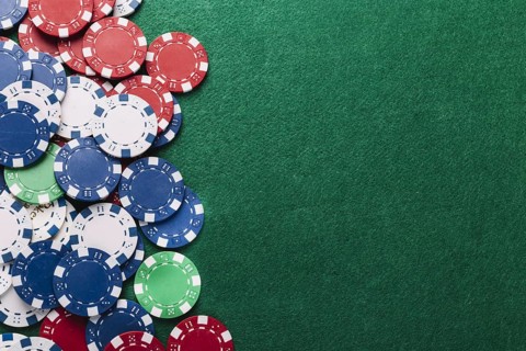 High angle view poker chips green table