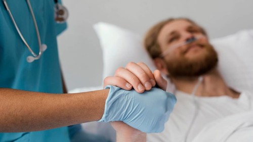 Close up patient health worker holding hands