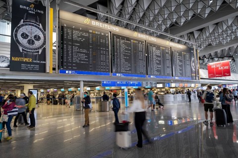 Frankfurt Airport, Fraport, Terminal 1 departure hall, passengers under a display panel, Frankfurt