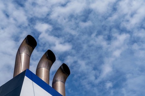 A detail view of three chimney smokestacks of a large passenger ferry
