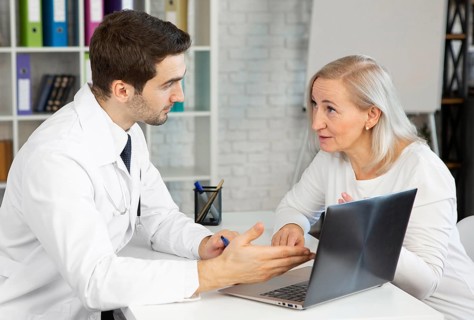 Medium shot doctor patient discussing