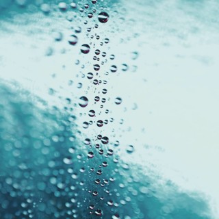 Abstract water drops turquoise glass background. High resolution photo