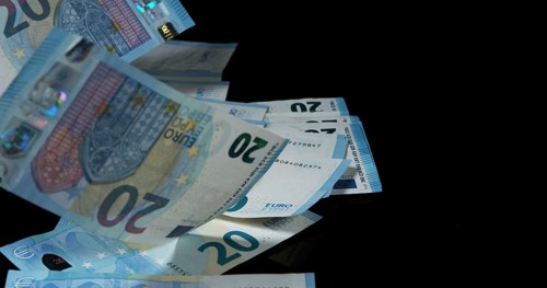 Euros Money Falling against Black Background