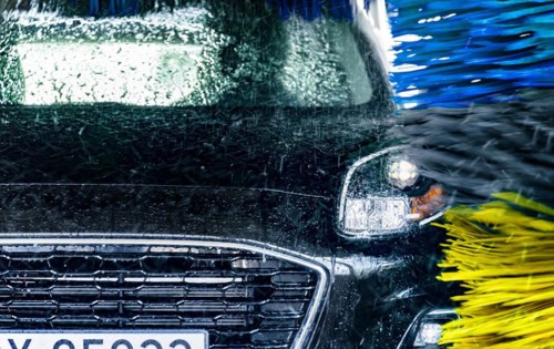 A vehicle in an automatic car wash