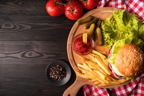 Composition delicious hamburger fries with copy space