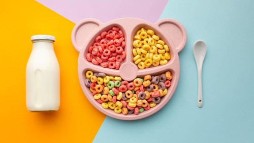 Top view delicious cereal with milk spoon