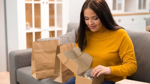 Woman unboxing her new purchase