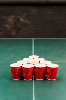 Red cups table beer pong tournament