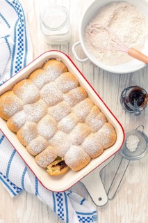 Sweet rolls, Buchteln filled with plum jam or jelly with backing ingredients