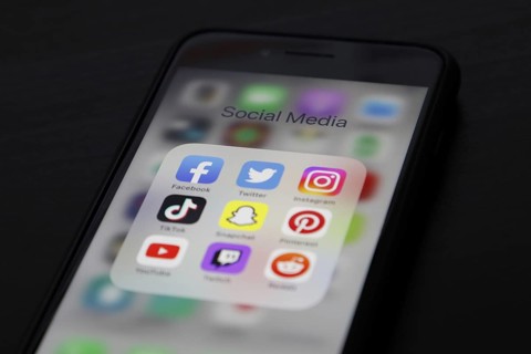 Social media icon, detailed view of a smartphone with social media apps, Facebook, Twitter,