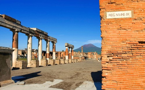 Ruins of Pompei or Pompeii with Vesuv in background with street sign in Latin in The Metropolitan