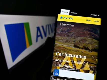 Stuttgart, Germany, 11-30-2022: Person holding smartphone with website of British insurance company
