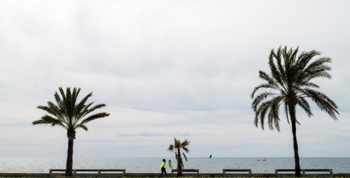 View of the sea and pedestrians from the seafront road Ma-19, Avenida de Gabrial Roca, Autopista de
