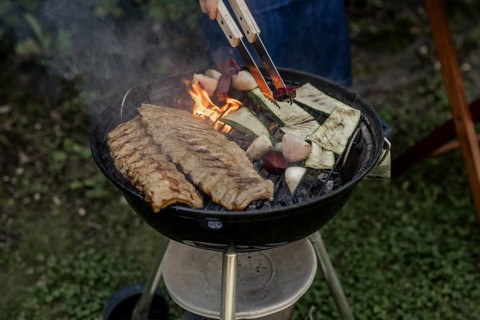 Man barbecuing in the garden