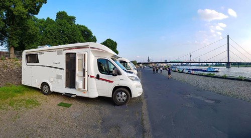 A motorhome parked at the Düsseldorfer Rheinuferpromenade motorhome park. Düsseldorf, North