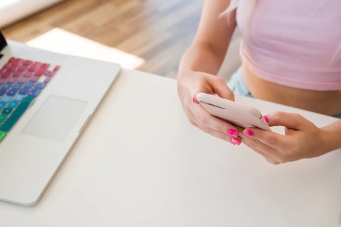 Blonde influencer using mobile phone