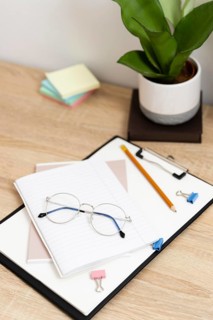 Close up clipboard glasses