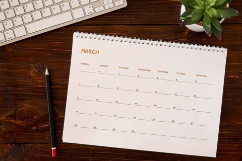 Top view desk calendar wooden table