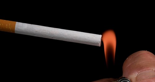 Cigarette that Consumes on Black Background