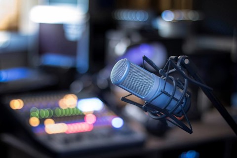 Professional studio microphone, recording studio, equipment in the blurry background