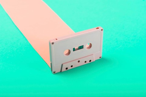 Close up retro cassette tape blue background