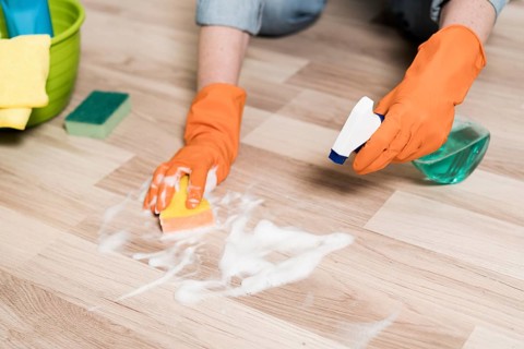 high angle woman cleaning floors