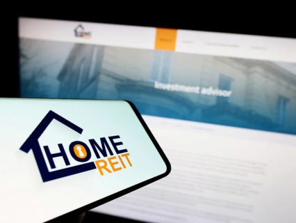 Stuttgart, Germany, 01-11-2023: Mobile phone with logo of British real estate company Home REIT plc