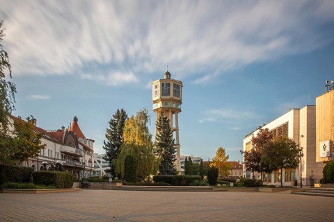 Historic water tower at sunset. Townscape of the tourist town of Siófok, Lake Balaton, Hungary,