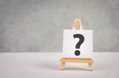 Question mark on an easel, education and business concept, searching for answers, thoughts for