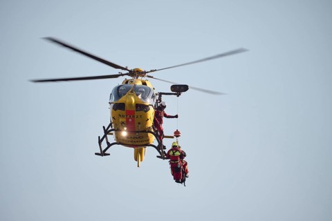 The ADAC air rescue service trains the use of the rescue hoist with an Airbus H145 helicopter,