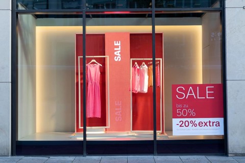 Symbolic image, shop window with sale lettering for the summer sale in a clothing shop in a